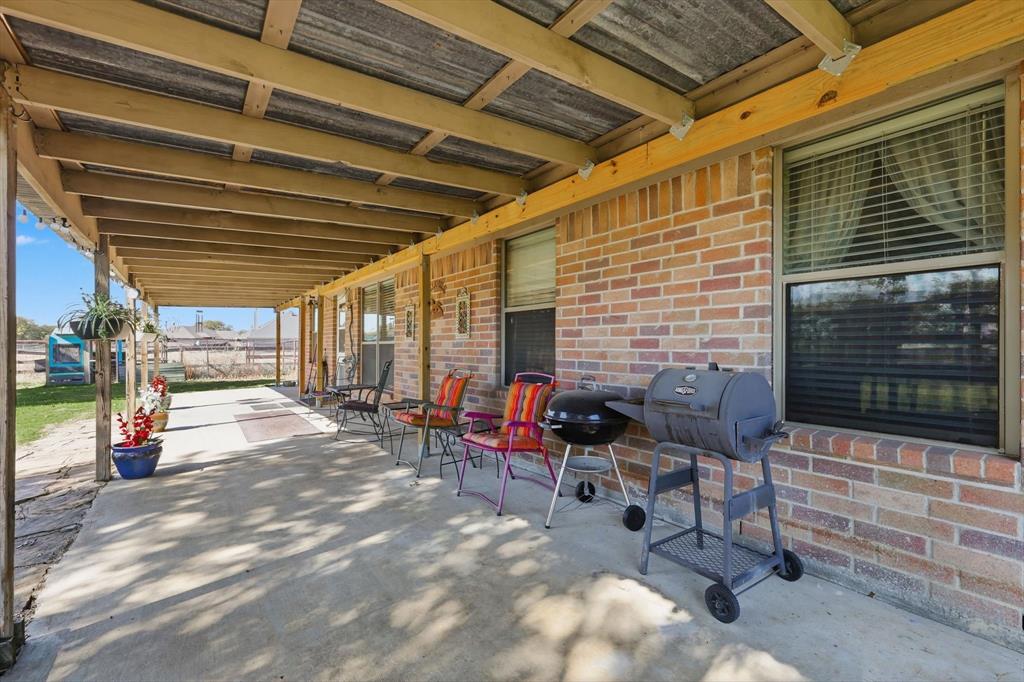 11649 Mitchell Circle Ponder, TX 76259 - Photo 25 of 38 a backyard of a house with seating space