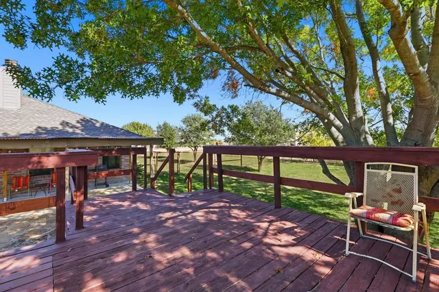 a view of a chairs and table in the patio