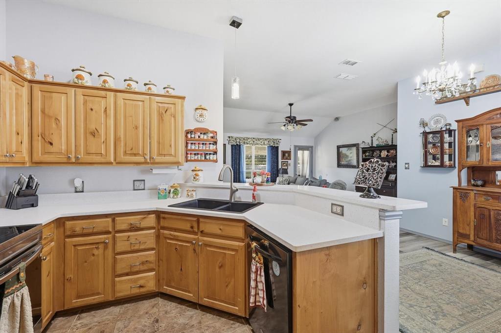 11649 Mitchell Circle Ponder, TX 76259 - Photo 7 of 38 a kitchen with a sink stove and microwave