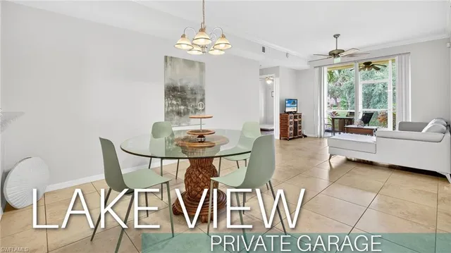 a view of a dining room with furniture wooden floor and chandelier