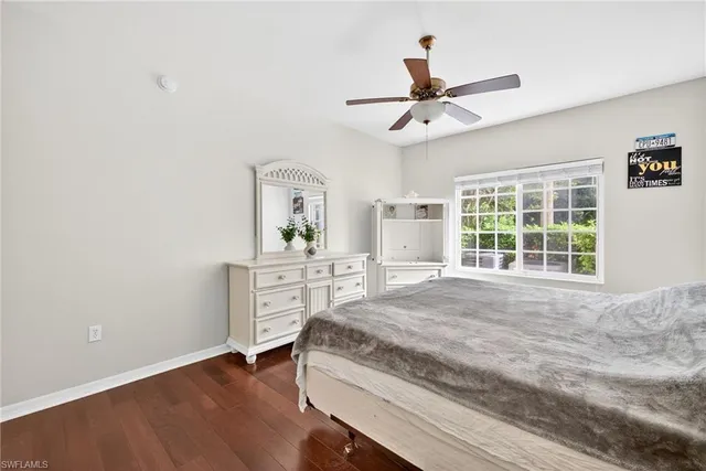 a spacious bedroom with a bed and a window