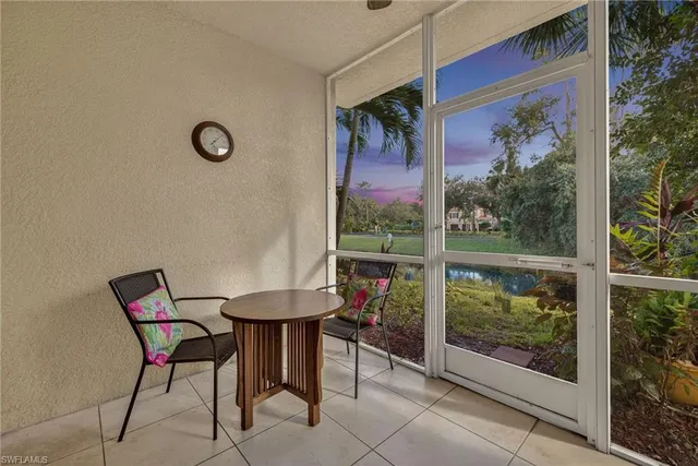 a view of a chairs and table in a room