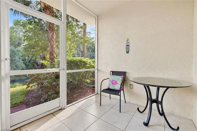 a view of a room with a wooden floor and a window