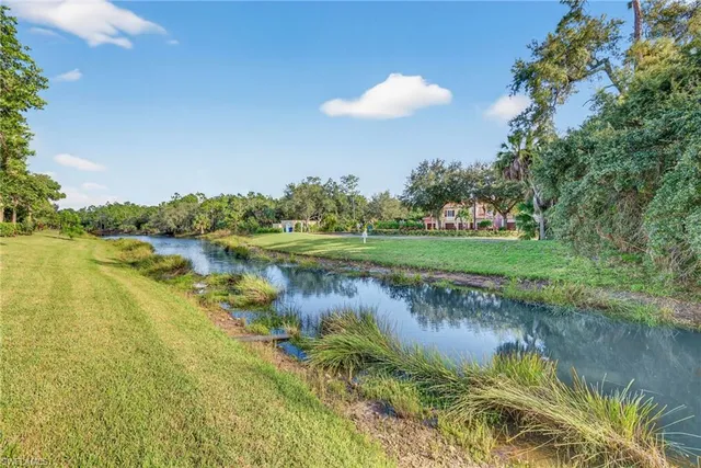 a view of a lake with a big yard