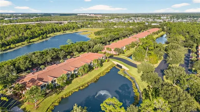 an aerial view of a city and lake view