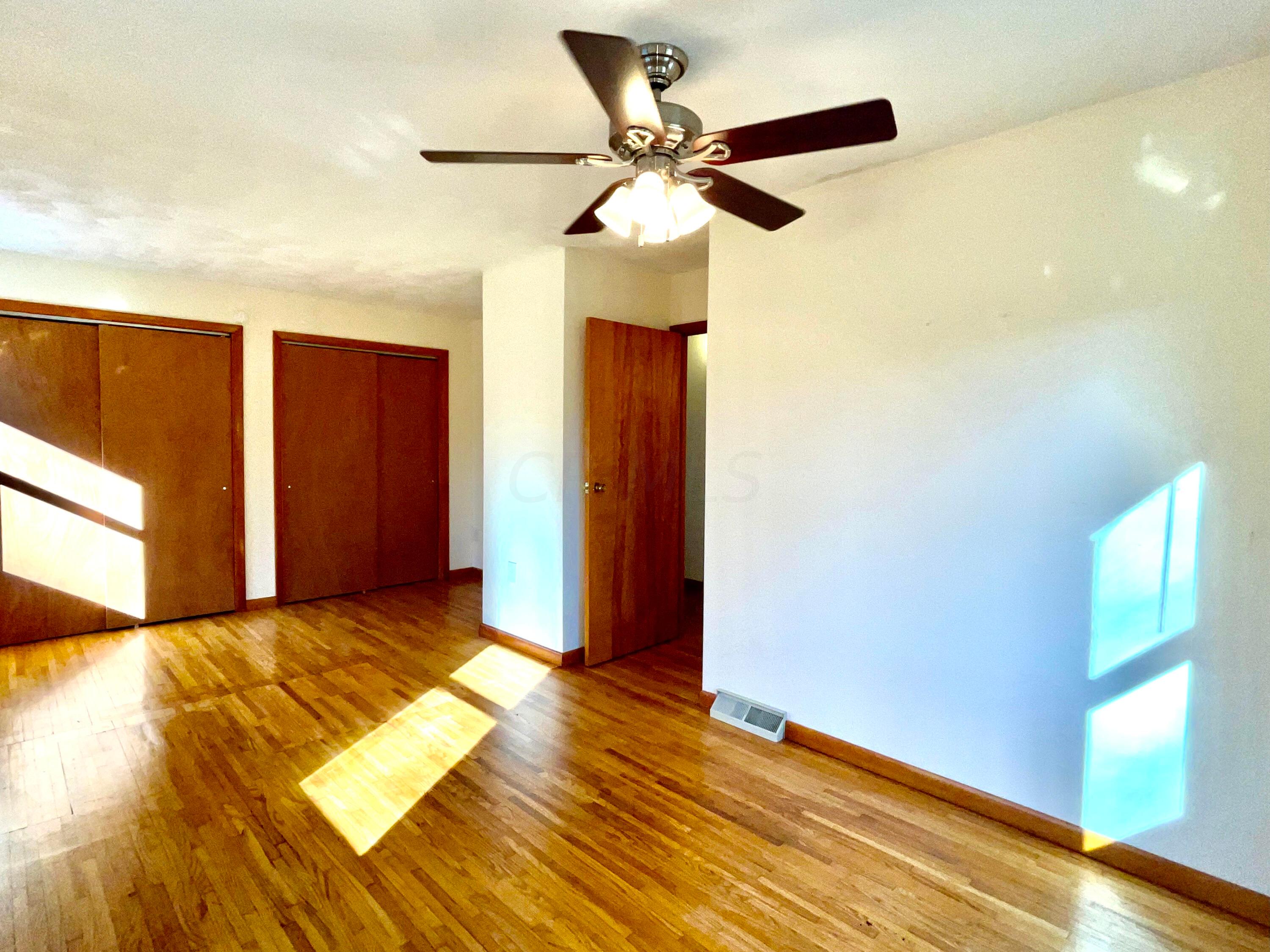 1368 Allen Road Beaver, OH 45613 - Photo 31 of 77 Bedroom 2 with original hardwood floors and a ceiling fan.