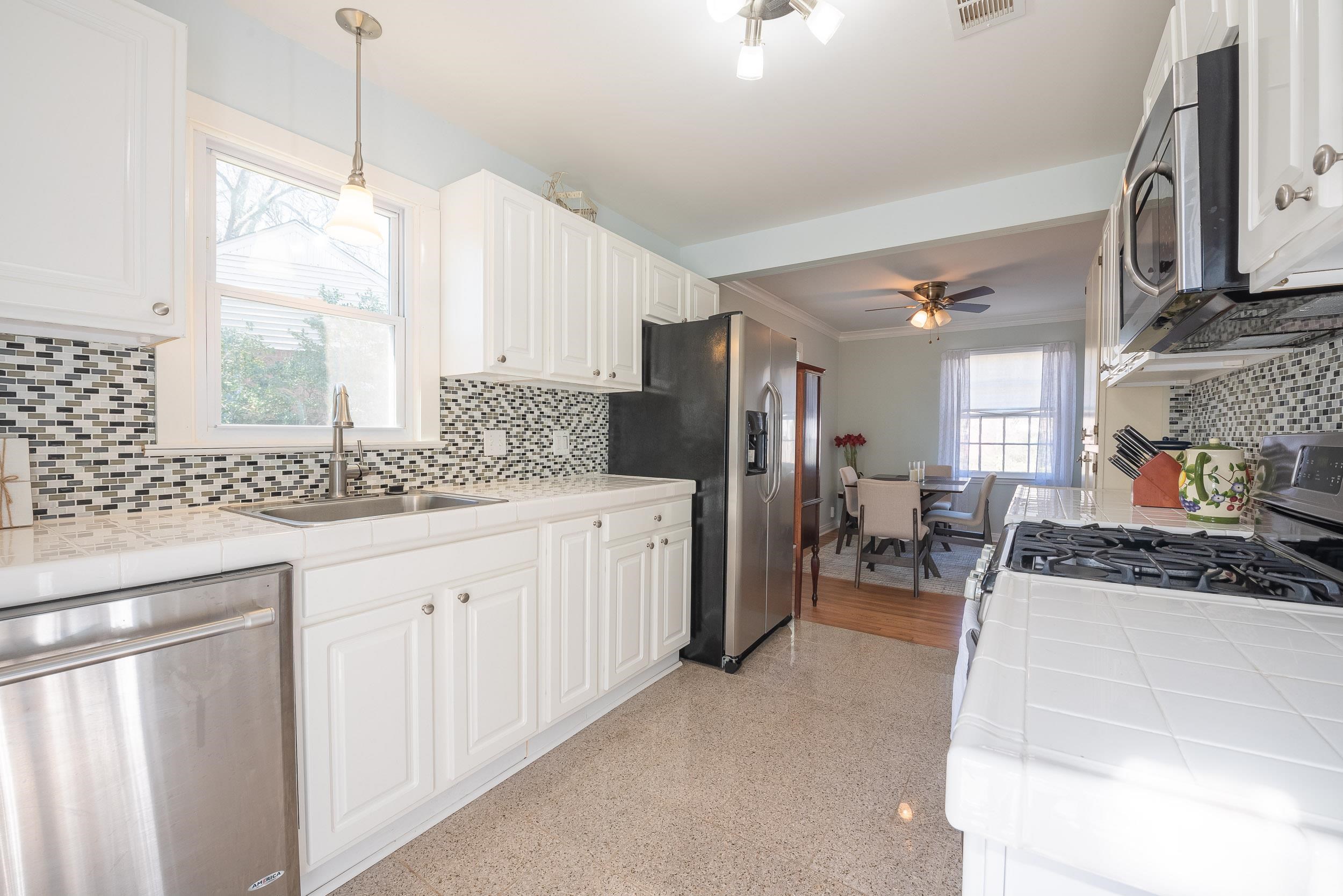 3805 Gamewell Road Memphis, TN 38111 - Photo 11 of 18 a kitchen with stainless steel appliances kitchen island granite countertop a sink and cabinets