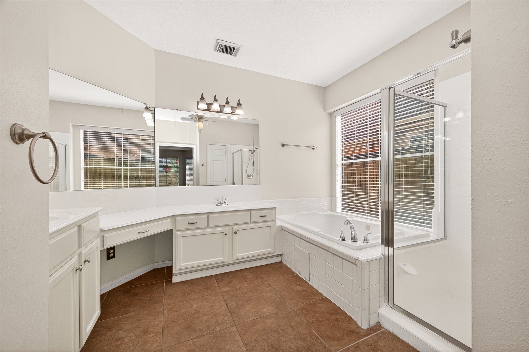 12831 Dove Point Lane Houston, TX 77041 - Photo 38 of 50 a bathroom with a tub sink and mirror