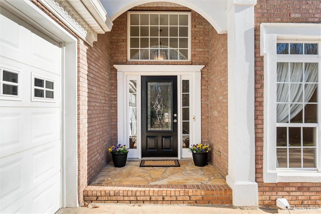 1030 Lakeview Parkway Villa Rica, GA 30180 - Photo 2 of 46 a view of a brick house with large windows