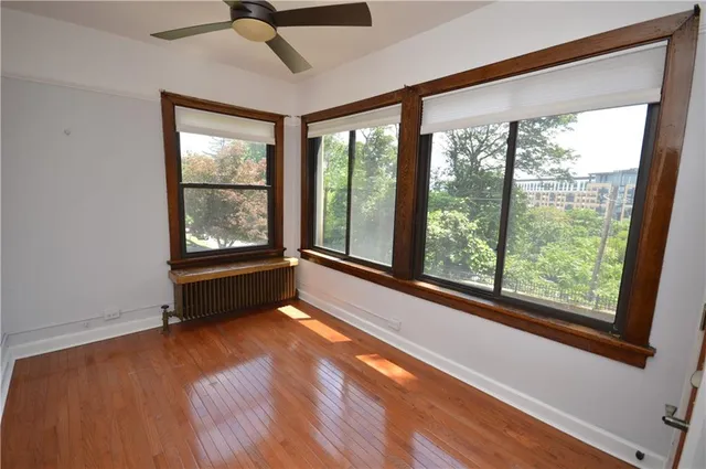 a view of room with window and hardwood floor