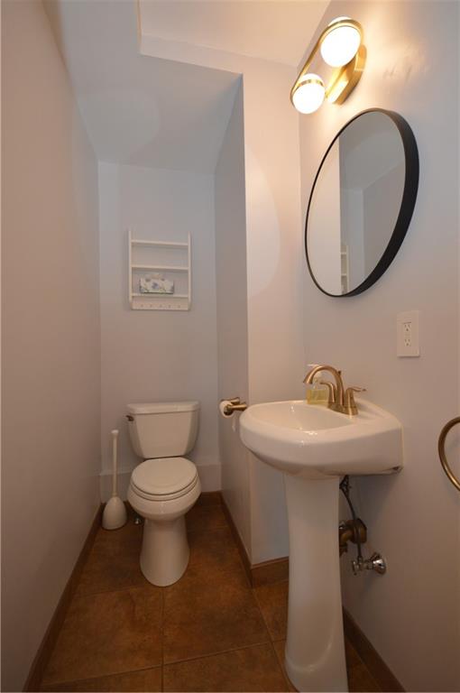 4323 Andover Terrace Pittsburgh, PA 15213 - Photo 17 of 48 a bathroom with a toilet sink and mirror