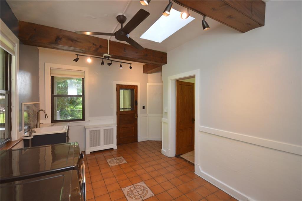4323 Andover Terrace Pittsburgh, PA 15213 - Photo 19 of 48 a kitchen with stainless steel appliances granite countertop a refrigerator and a sink