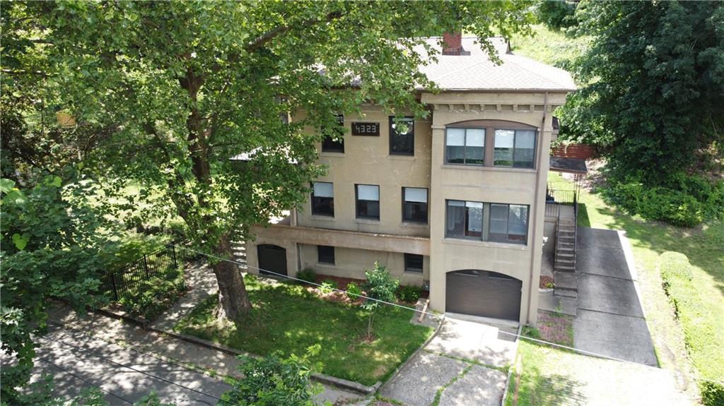 4323 Andover Terrace Pittsburgh, PA 15213 - Photo 2 of 48 a front view of a house with a garden