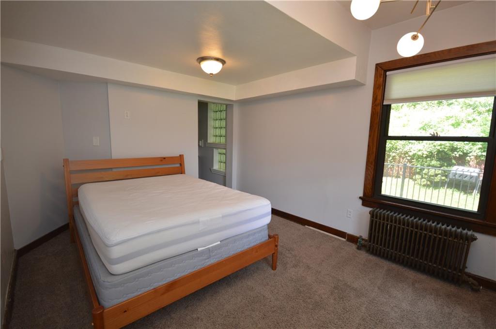 4323 Andover Terrace Pittsburgh, PA 15213 - Photo 21 of 48 a bedroom with a bed and window