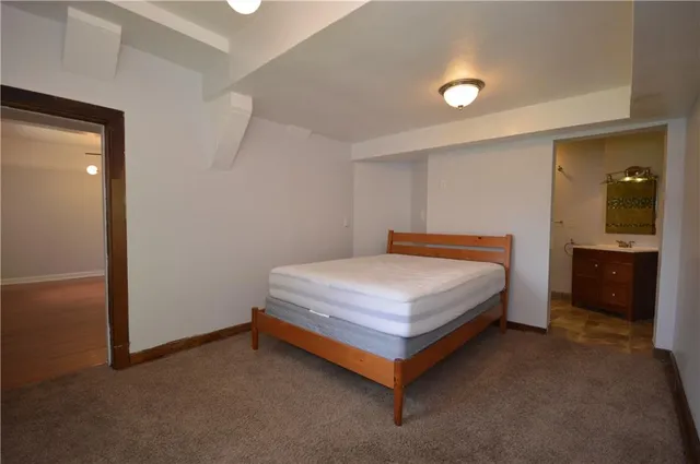 a bedroom with a bed and a walk in closet