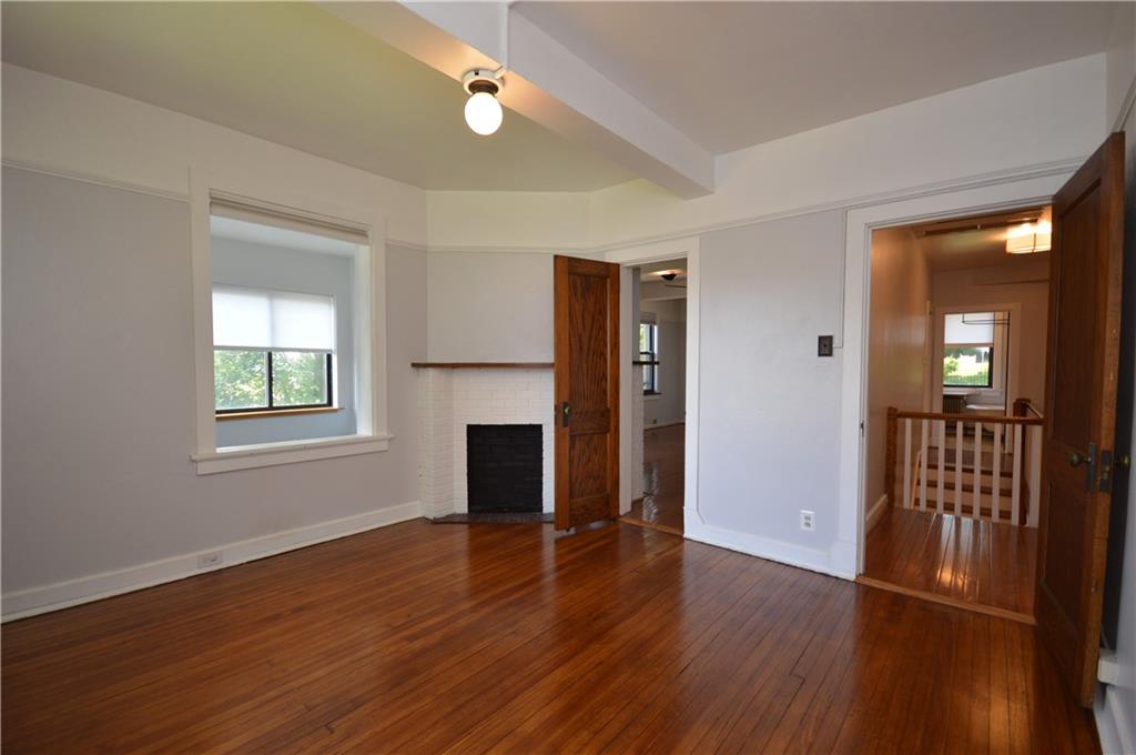 4323 Andover Terrace Pittsburgh, PA 15213 - Photo 27 of 48 an empty room with wooden floor and windows