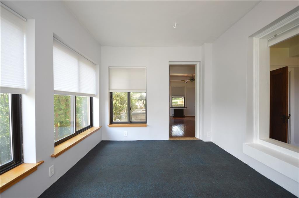 4323 Andover Terrace Pittsburgh, PA 15213 - Photo 29 of 48 a view of an empty room with a window and fire place