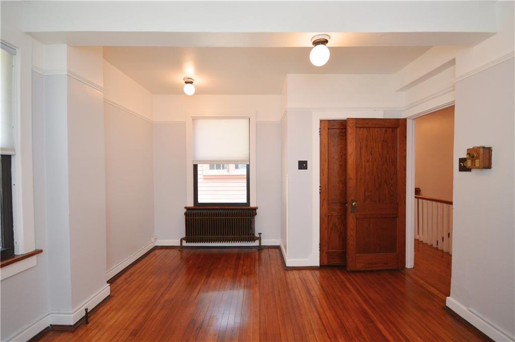 4323 Andover Terrace Pittsburgh, PA 15213 - Photo 32 of 48 wooden floor in an empty room with a window