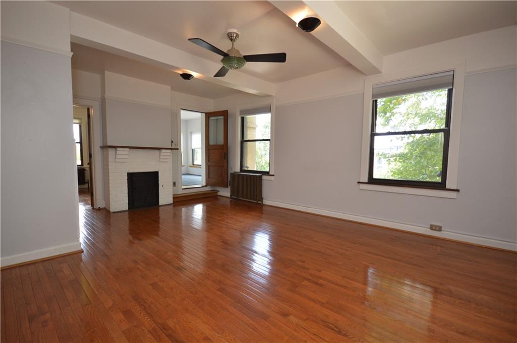 4323 Andover Terrace Pittsburgh, PA 15213 - Photo 34 of 48 a view of an empty room with wooden floor and a window
