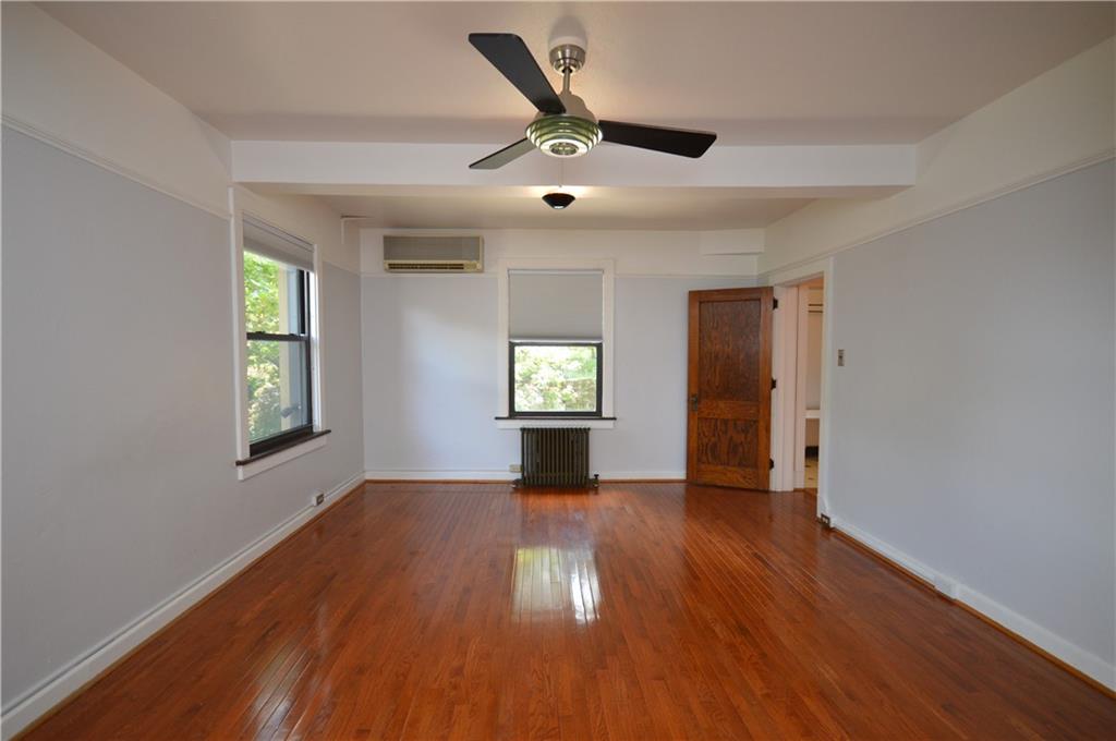4323 Andover Terrace Pittsburgh, PA 15213 - Photo 35 of 48 a view of an empty room with window and wooden floor