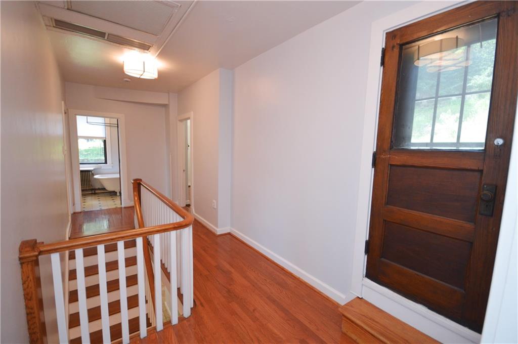 4323 Andover Terrace Pittsburgh, PA 15213 - Photo 37 of 48 a view of hallway with a large window and wooden floor