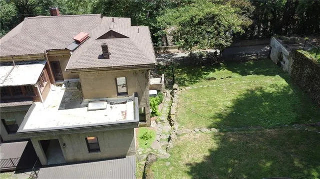 a aerial view of a house with a yard