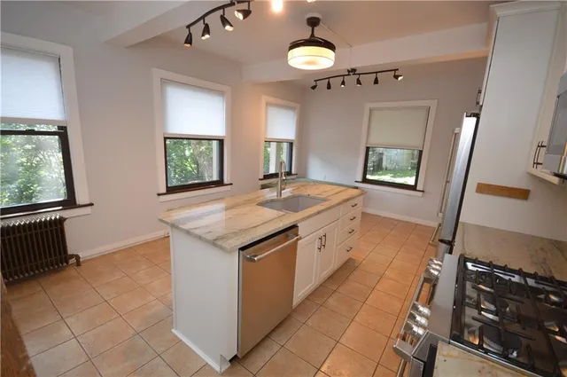 a kitchen with a stove and a sink