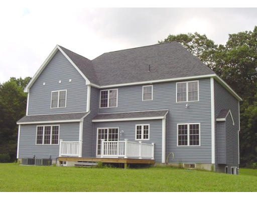 57 Ramshorn Road Charlton, MA 01507 - Photo 2 of 12 a front view of a house with a yard
