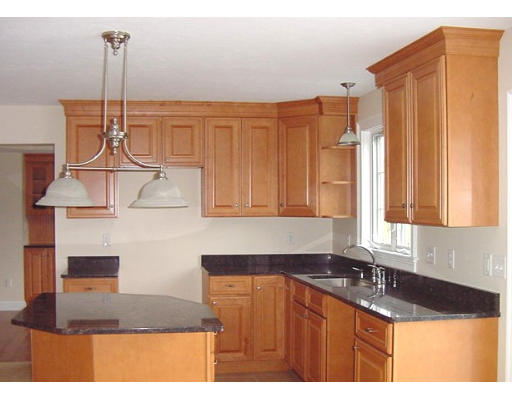 57 Ramshorn Road Charlton, MA 01507 - Photo 5 of 12 a kitchen with kitchen island granite countertop a sink a counter top space and cabinets