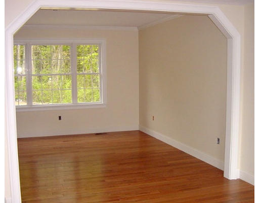 57 Ramshorn Road Charlton, MA 01507 - Photo 8 of 12 a view of an empty room with wooden floor and a window