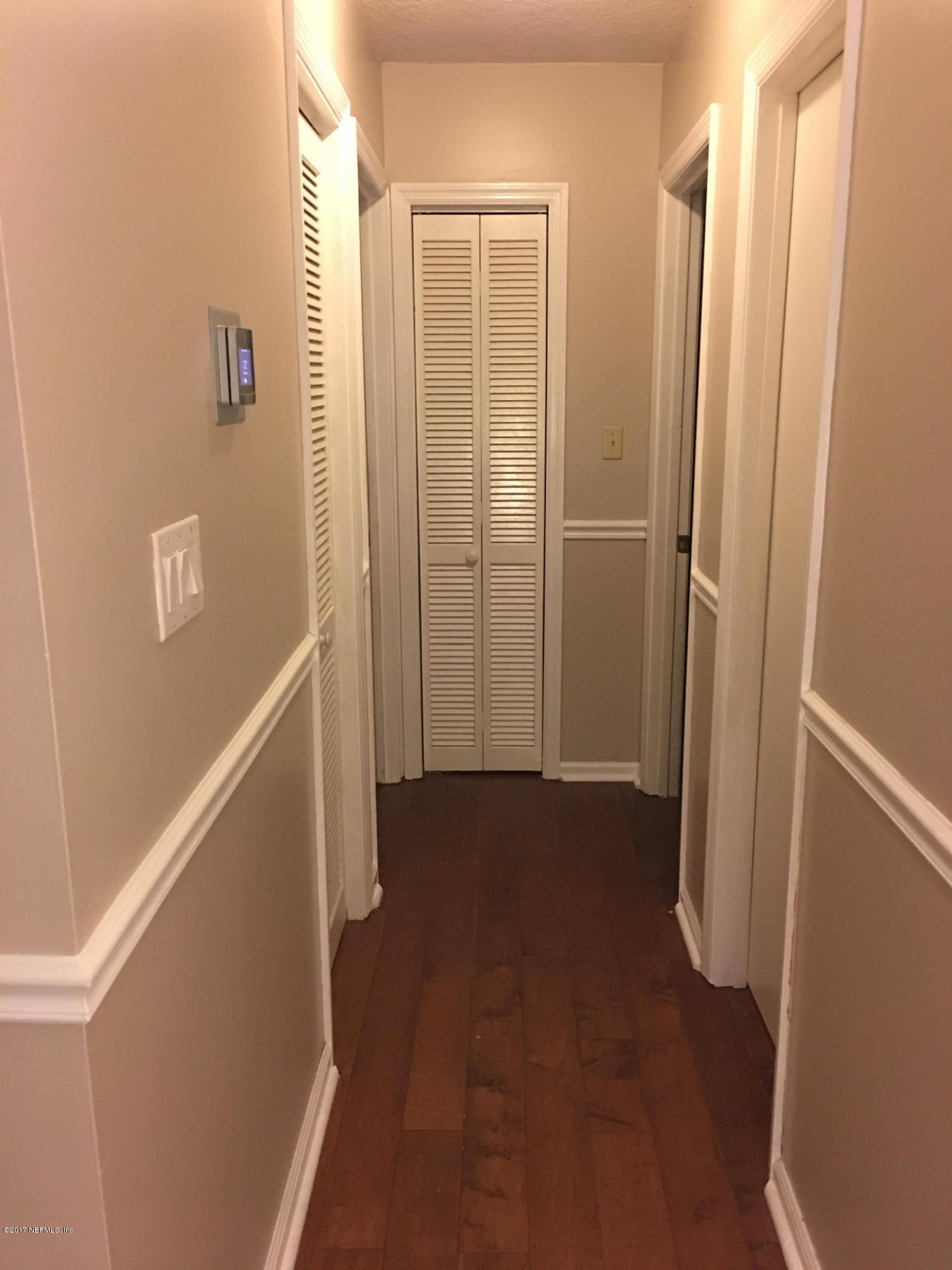 86054 Spring Meadow Avenue Yulee, FL 32097 - Photo 13 of 28 Hall into bathroom 2 & 3 and guest bath