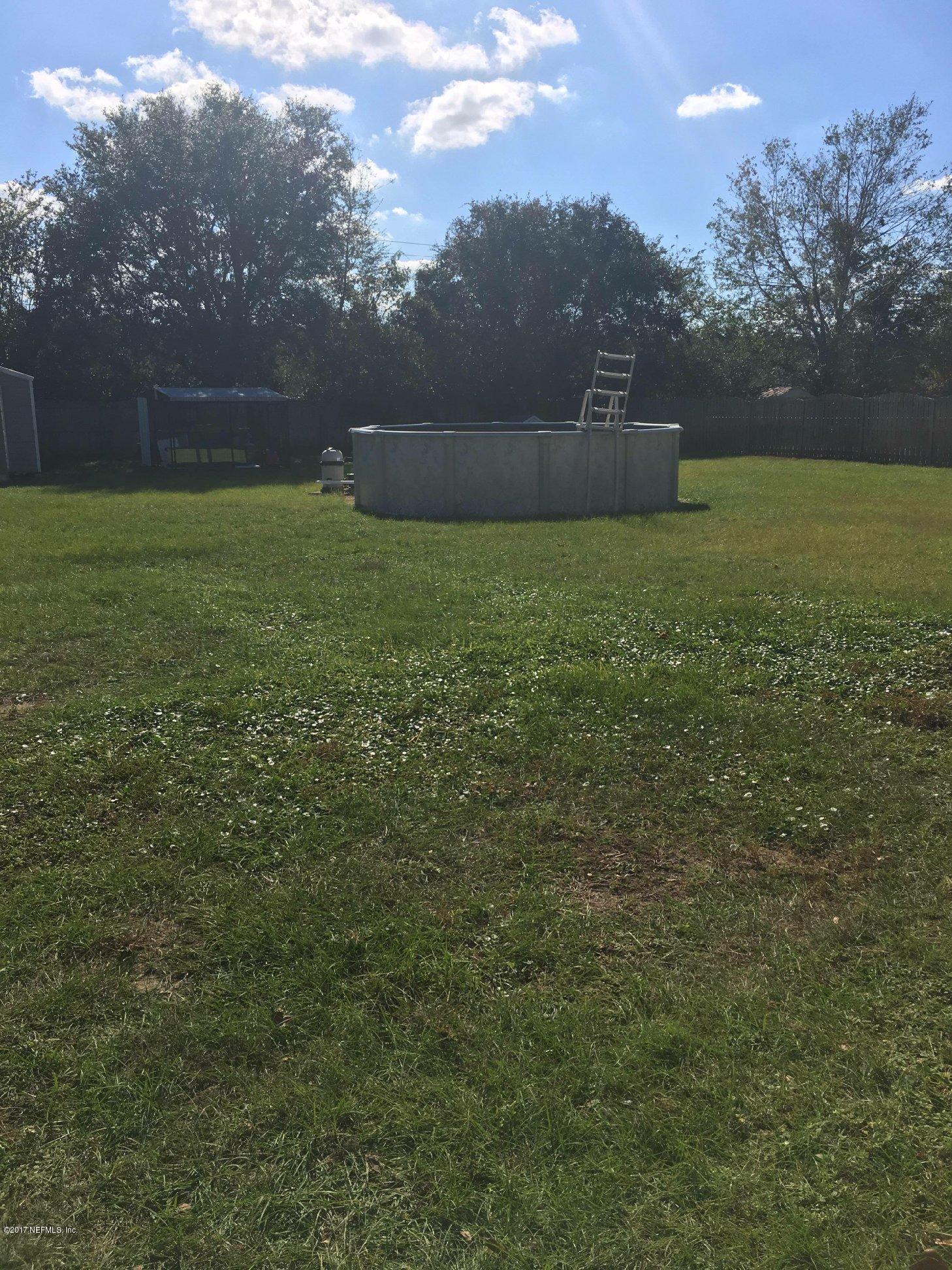 86054 Spring Meadow Avenue Yulee, FL 32097 - Photo 26 of 28 Back yard and Pool