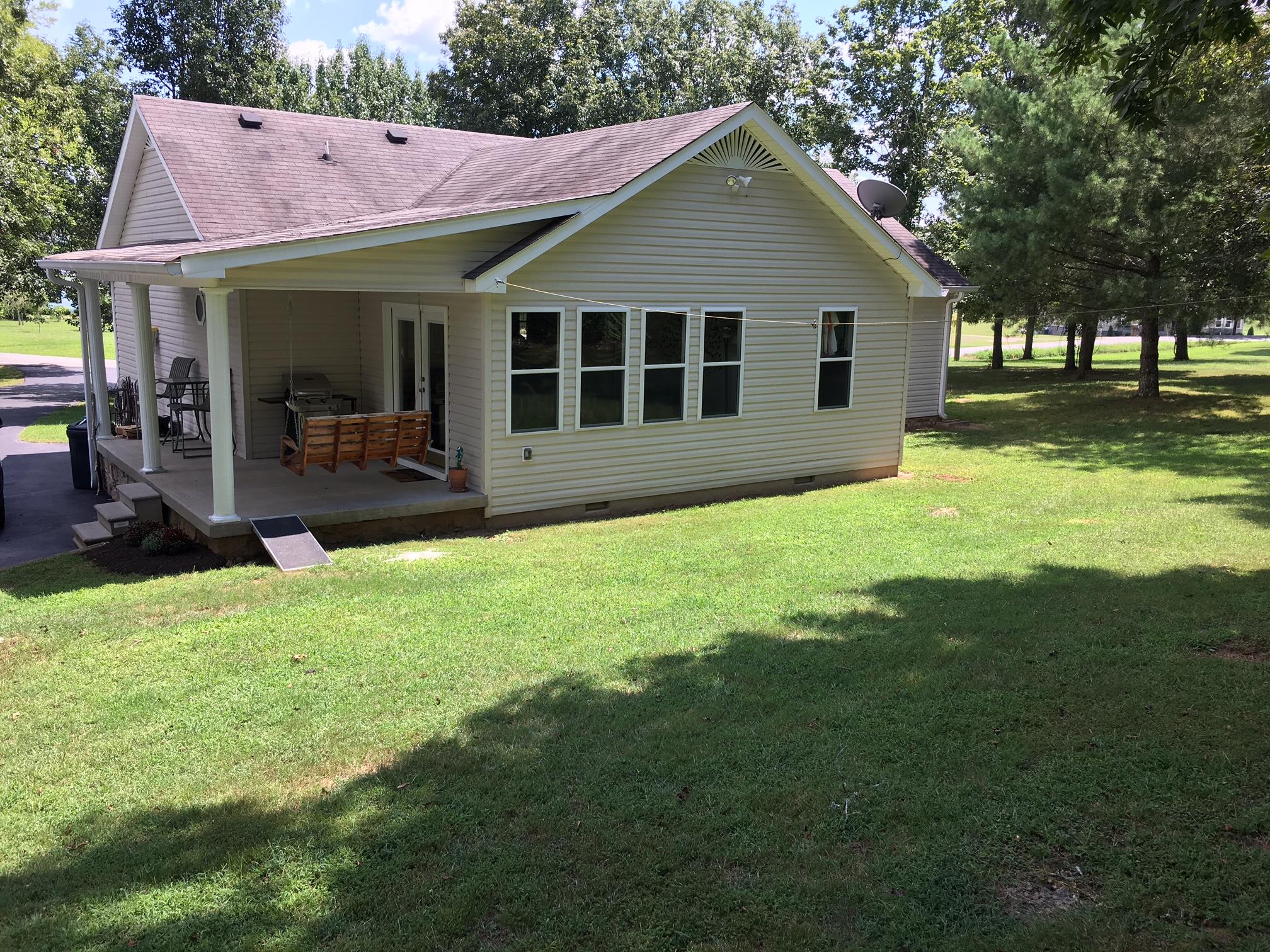 2055 Holloway Road Lebanon, TN 37090 - Photo 8 of 10 a view of a house with a garden and yard