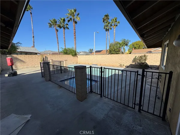 a view of street with wooden fence