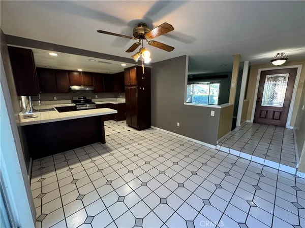 a kitchen with a sink cabinets and window
