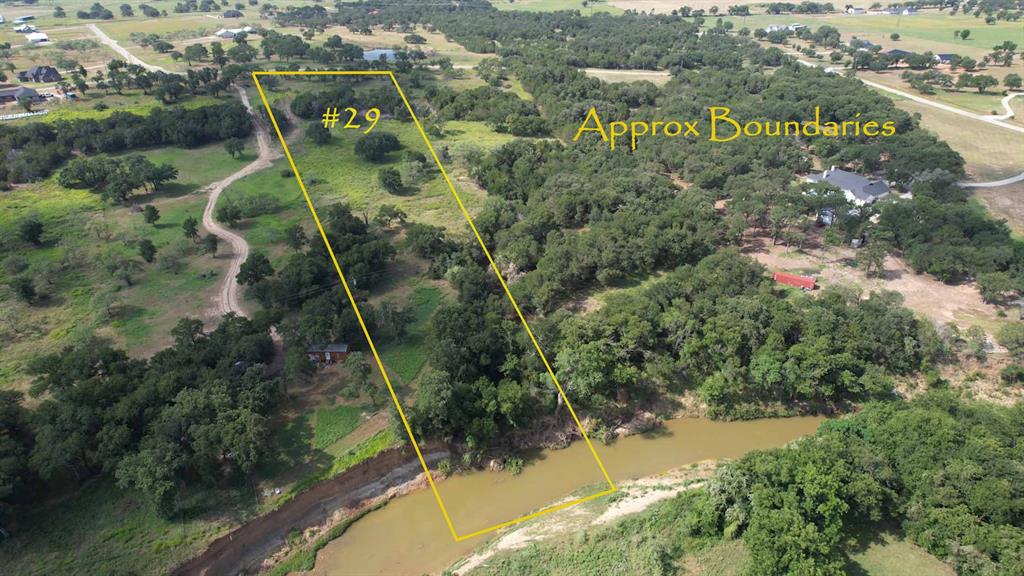 Tbd Lot 29 Tbd Lane Santo, TX 76472 - Photo 2 of 5 an aerial view of residential houses with outdoor space