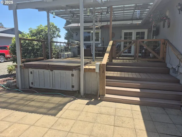 a view of a house with a large window and stairs