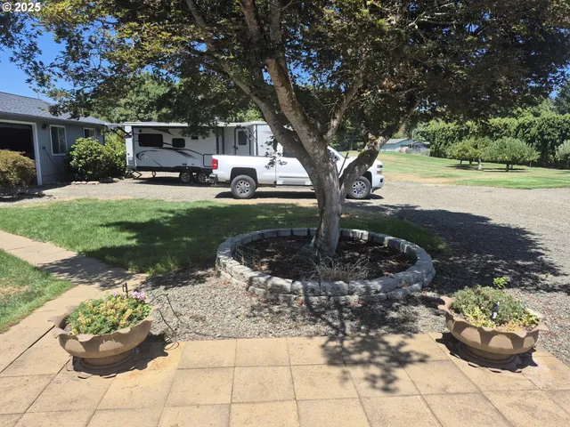 a view of a garden with patio