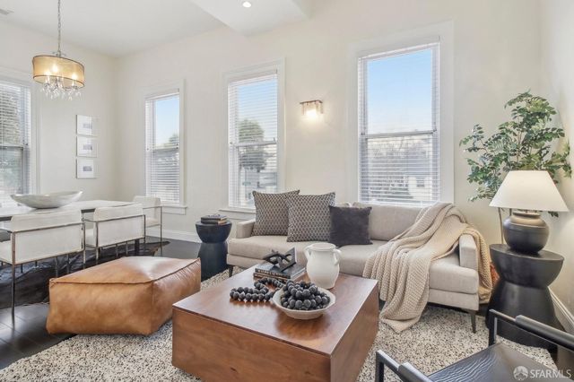 a living room with furniture and a table