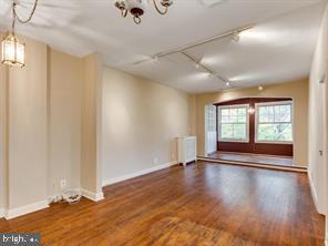 2737 Devonshire Place Northwest, Unit 129 Washington, DC 20008 - Photo 17 of 30 an empty room with wooden floor and windows