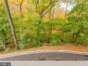 2737 Devonshire Place Northwest, Unit 129 Washington, DC 20008 - Photo 19 of 30 front view of a house with a yard