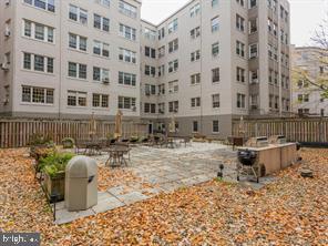 2737 Devonshire Place Northwest, Unit 129 Washington, DC 20008 - Photo 22 of 30 a view of a chairs and table in backyard