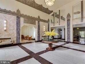 2737 Devonshire Place Northwest, Unit 129 Washington, DC 20008 - Photo 3 of 30 a lobby with furniture and a chandelier