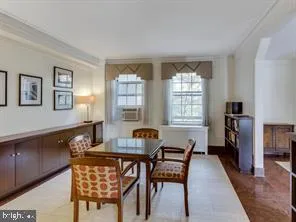 a dining room with furniture and window