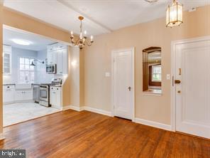 2737 Devonshire Place Northwest, Unit 129 Washington, DC 20008 - Photo 6 of 30 a view of a kitchen with an empty room and kitchen view