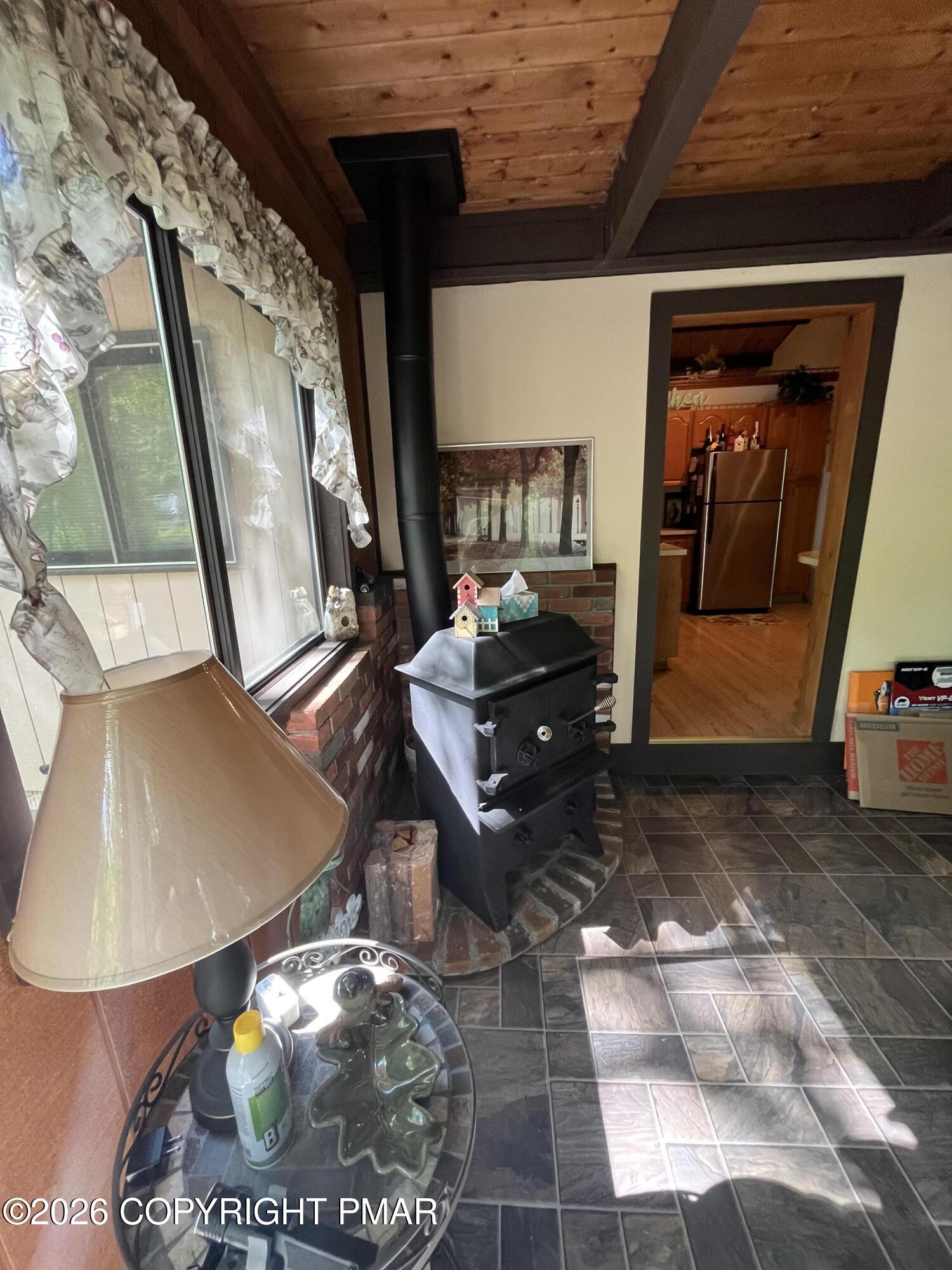5970 Decker Road Bushkill, PA 18324 - Photo 12 of 26 a living room with furniture and a mirror