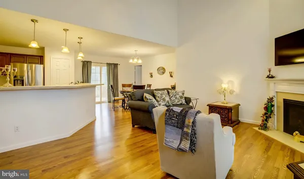 a living room with fireplace furniture and a flat screen tv