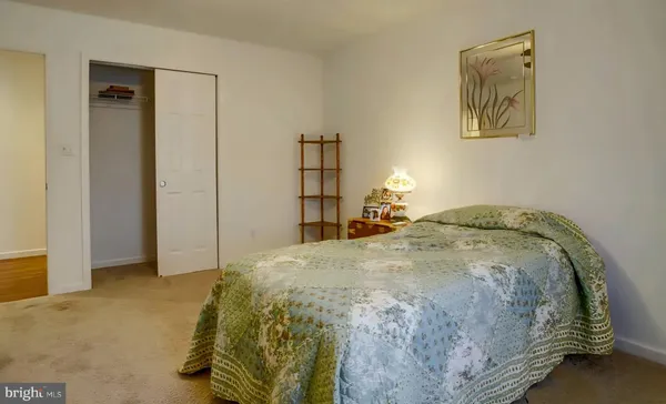 a bedroom with a bed and a cabinets