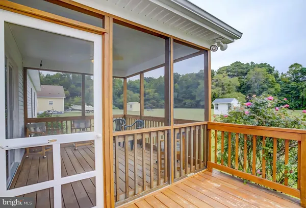 a view of a balcony with wooden floor