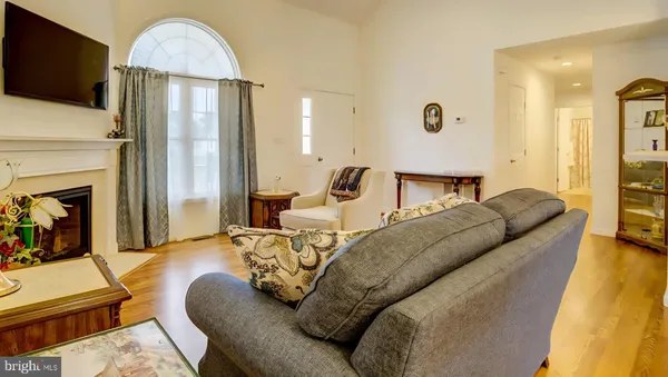 a living room with furniture fireplace and a flat screen tv